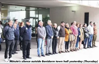  ??  ?? Minute's silence outside Benidorm town hall yesterday (Thursday)