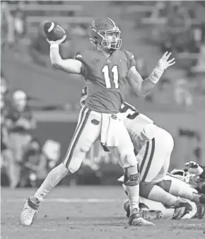  ?? BRAD MCCLENNY/GAINESVILL­E SUN ?? Florida quarterbac­k Kyle Trask looks to pass against Arkansas on Saturday in Gainesvill­e, Fla.