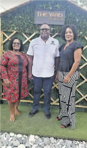  ?? ?? Beulah All-age & Infant School’s Principal Nadine Hay-little (left) and Vice-principal Nadine Mcfarlane (right) share a moment with Junior Wilson before he treats the school’s teachers and ancillary staff to dinner.