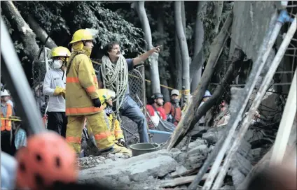  ?? PICTURE: AP ?? First responders work to remove the rubble of a collapsed building to try and find survivors after a 7.1 earthquake in Mexico City on Tuesday.