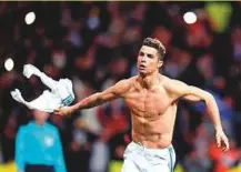  ?? AFP ?? Real Madrid’s Cristiano Ronaldo celebrates after scoring the late penalty against Juventus in the Champions League.