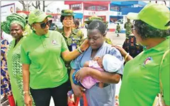  ?? ?? Mrs. Oghogho with one of the wives of the fallen heroes