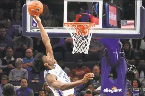  ?? Karen Pulfer Focht / Associated Press ?? Memphis’ James Wiseman dunks against South Carolina State on Nov. 5. Wiseman says he has withdrawn from school as the likely NBA lottery pick gets ready to begin his pro career.