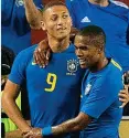  ??  ?? Cloud nine: Richarliso­n (left) with Douglas Costa