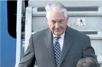  ?? IVAN SEKRETAREV/THE ASSOCIATED PRESS ?? U.S. Secretary of State Rex Tillerson steps out of a plane upon arrival in Moscow’s Vnukovo airport, Russia, on Tuesday. Tillerson is due to meet with Russian Foreign Minister Sergey Lavrov on Wednesday.