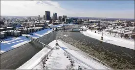  ?? TY GREENLEES / STAFF ?? Ice flows down the Great Miami River at the confluence with the Mad River. Dayton is asking Wright-Patterson to act before groundwate­r contaminat­ed with a byproduct of firefighti­ng foam reaches seven city drinking water wells shut down as a precaution...