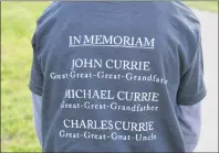  ?? CHRISTIAN ROACH/CAPE BRETON POST ?? The names of family members lost by Sam Rau and the rest of his family that travelled from Ontario to be in New Waterford are pictured on the back of his T-shirt.