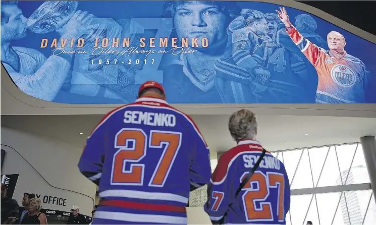  ?? LARRY WONG ?? Patrick Bohnet, left, and Vera Buzak arrive at Rogers Place to join in a celebratio­n of life for former Oiler Dave Semenko on Thursday. Semenko died last week. He was 59.