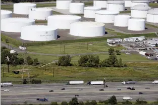  ?? MARK LENNIHAN — THE ASSOCIATED PRESS FILE ?? In this Sept. 8, 2008file photo traffic on I-95passes oil storage tanks owned by the Colonial Pipeline Company in Linden, N.J.