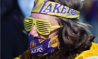  ?? Photograph: Ringo Chiu/Reuters ?? An LA Lakers fan celebrates the team’s championsh­ip last season.