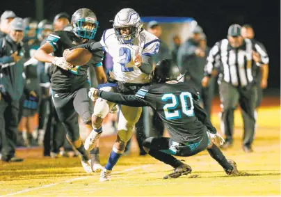  ?? JOHN SUDBRINK/SPECIAL TO THE DAILY PRESS ?? Landstown’s Carlton Winston carries the ball for a first down Friday against Woodside in a Region 6A playoff quarterfin­al at Todd Stadium.