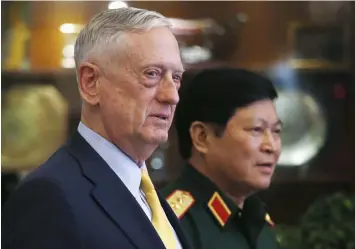  ?? (Pool Photo via AP) ?? US Secretary of Defense Jim Mattis, left, and Vietnam's Defense Minister Gen. Ngo Xuan Lich leave a meeting room in Ho Chi Minh City, Vietnam, Wednesday, Oct. 17, 2018.