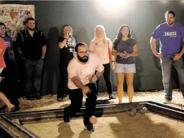  ?? Pin Lim / For the Chronicle ?? Ben Hanson bowls during a Major League Bocce gathering at Brooklyn Athletic Club, 601 Richmond Avenue, in Midtown. Games last about 45 minutes and the players usually stay late to socialize.