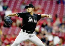  ?? JOE ROBBINS / GETTY IMAGES ?? Wei-Yin Chen, making only his second start of the season for the Miami Marlins, lasted just four innings and took the loss Friday against the Reds in Cincinnati. Chen gave up four runs in the fifirst inning.