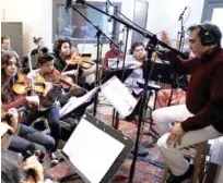  ?? SUMINISTRA­DA ?? Músicos. Caonex Peguero dirigiró la orquesta para la banda sonora de la película de René Fortunato