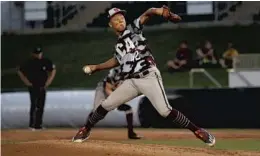  ?? KELLI KREBS / CORRESPOND­ENT/COURTESY ?? Lake Worth-Trinity Christian Academy’s Irv Carter pitches during the FHSAA Class 2A championsh­ip game against Deltona-Trinity Christian Academy in Fort Myers.