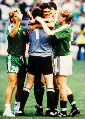 ??  ?? Goalscorin­g hero David O’Leary is mobbed by jubilant team-mates John Byrne, Packie Bonner, Niall Quinn and Steve Staunton.