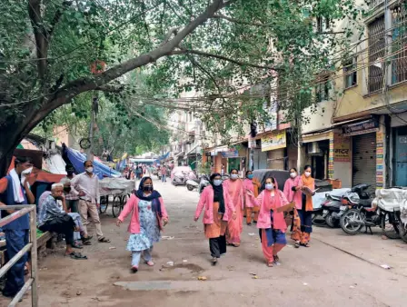  ??  ?? ACCREDITED SOCIAL HEALTH ACTIVIST in New Delhi on July 2.
(ASHA) workers conducting a door-to-door survey on the COVID-19 situation,