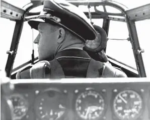  ??  ?? Visibility from the Bf 110 cockpit was excellent for the time. Here the pilot wears his Schirmmutz­e (peaked service cap) instead of a Helmetluft as he would in combat. (Photo courtesy of Coll. RJF)