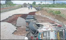  ?? ANI ?? A section of a highway caves in after heavy rain in Shivpuri.