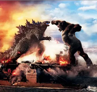  ?? WARNER BROS. ?? Godzilla, left, battles ape nemesis King Kong in the overblown monster movie Godzilla vs. Kong.