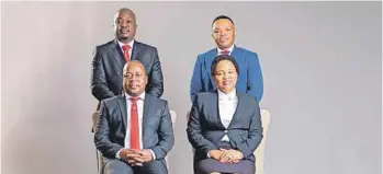  ??  ?? Back Row: left to right MMC for Finance: Nkosindiph­ile Xhakaza; GCFO: Kagiso Lerutla Front Row: left to right - Executive Mayor: Cllr Mzwandile Masina; City Manager: Dr Imogen Mashazi