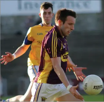  ??  ?? Wing-back Robbie Barron on a burst upfield as Longford’s Shane Kenny looks on.