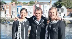  ??  ?? Award finalists: Sailors Jo Aleh and Polly Powrie with coach Nathan Handley in Weymouth at the 2012 Olympics.