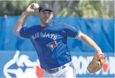  ?? FRANK GUNN/THE CANADIAN PRESS ?? Toronto Blue Jays starting pitcher Joe Biagini throws out Philadelph­ia Phillies Cameron Rupp during spring training action in Dunedin, Fla. on Friday.