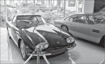  ?? SUBMITTED PHOTO/MATT BUBBERS ?? A 1967 Lamborghin­i 400 GT 2+2 and a 1963 Aston Martin DB5 on display at Grand Touring Automobile­s during a launch event in May. Demand for super luxury cars in Canada is skyrocketi­ng.