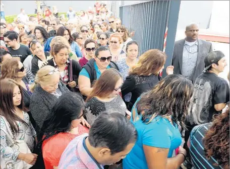  ?? Christina House
For The Times ?? WORKERS enter the PennySaver plant in Brea for a meeting May 26, four days after the coupon-mailing company’s abrupt closure.