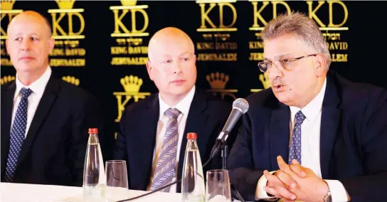  ??  ?? Mazin Ghunaim speaks as Jason Greenblatt, center, and Tzachi Hanegbi sit next to him during a news conference in Jerusalem on Thursday. (AFP)