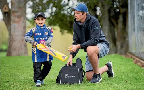  ?? CHRISTEL YARDLEY/STUFF ?? Brave five-year-old refugee Muhammad enjoys a surprise game of backyard cricket with Black Caps allrounder Tim Southee.