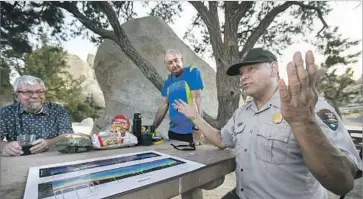  ??  ?? TOM O’KEY, left, Wally Pacholka and Luke Sabala helped win the coveted Dark Sky certificat­ion. The park’s western sky is polluted by nearby urban areas, but its eastern side has levels of darkness unique in the state.