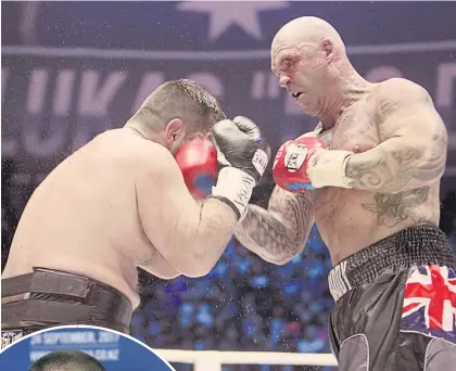  ?? Picture / AP ?? Australia's Lucas Browne, right, hits Uzbekistan's Ruslan Chagaev during their WBA world heavyweigh­t title bout. Browne, who later failed a drugs test, has called out Parker.