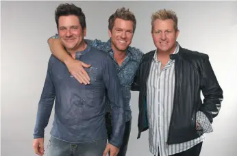  ?? HANDOUT PHOTO ?? Jay DeMarcus, Joe Don Rooney and Gary LeVox of Rascal Flatts pose at the Wonderwall portrait studio during the 2013 CMT Music Awards in Nashville, Tenn. Rascal Flatts will perform at CN Centre on Oct. 27.