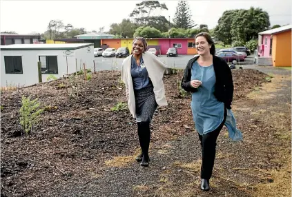  ?? PHOTOS: ANDY JACKSON/STUFF ?? Tracey Bryant, right, and sales and marketing manager Petunia Twala wander around the ground for the revamped community garden.