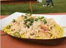  ?? Soleil Ho / The Chronicle ?? Crab with garlic noodles from Chef Smelly at Outside Lands.