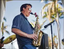  ?? POST GREG LOVETT / THE PALM BEACH ?? Wayne Gutshall plays the saxophone at the Ward’s Marine Electric tent Thursday at the boat show, which offers live music, seminars, kids’ fishing clinics and other attraction­s through Sunday.