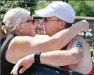  ?? Penticton Herald ?? Penticton duathlete Paul Varga embraces his wife, Shirley, after the race.