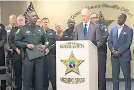  ?? COURTESY OF ORLANDO POLICE ?? Central Florida law enforcemen­t leaders joined Gov. Rick Scott Thursday morning for a signing of House Bill 477, which enhances penalties for synthetic opioids like fentanyl.