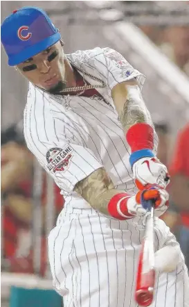  ?? ALEX BRANDON/AP ?? Cubs star Javy Baez took part in the Home Run Derby at All-Star festivitie­s Monday. He lost in the first round to the Dodgers’ Max Muncy 17-16.