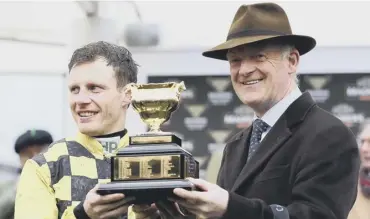  ??  ?? 0 Jockey Paul Townend and trainer Willie Mullins after Al Boum Photo’s Gold Cup victory last year.