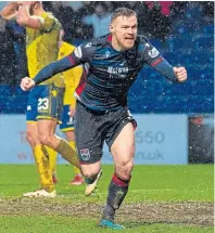  ??  ?? On form: Billy Mckay celebrates his late equaliser