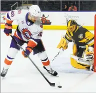  ?? Christian Abraham / Hearst Connecticu­t Media ?? The Sound Tigers’ Kieffer Bellows gets the puck near Wilkes-Barre/Scranton goalie Casey DeSmith on Oct. 19.