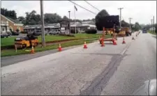  ?? FRAN MAYE – DIGITAL FIRST MEDIA ?? Workers begin constructi­on on a sidewalk that will connect the western edge of Kennett Square to the New Garden Shopping Center.