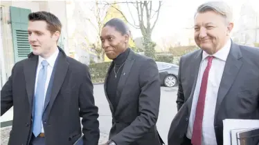  ??  ?? OLYMPIC gold medallist Caster Semenya, centre, and her lawyer, Gregory Nott, right, arrive for the first day of a hearing at the Court of Arbitratio­n for Sport in Lausanne, Switzerlan­d on Monday. | AP
