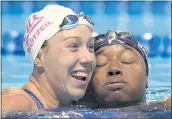  ?? JEFF ROBERSON — THE ASSOCIATED PRESS ?? Simone Manuel, right, and Abbey Weitzeil hug after the women’s 50 freestyle during the U.S. Olympic Swim