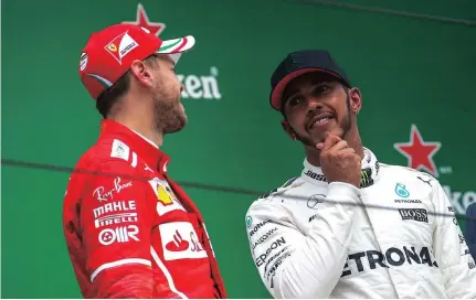  ?? PICTURE: EPA ?? Sebastian Vettel (left) has two wins to Lewis Hamilton’s one so far.
