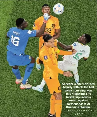  ?? /DAN MULLAN /GETTY IMAGES ?? Senegal keeper Edouard Mendy deflects the ball away from Virgil van Dijk during the Fifa World Cup Group A match against Netherland­s at Al Thumama Stadium.